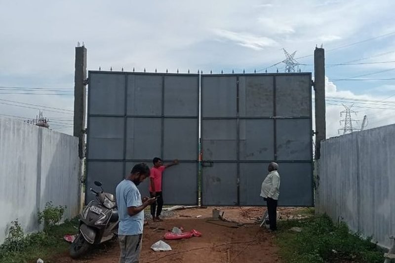 Double-leaf framed MS gate with sheet infill installed on RCC posts