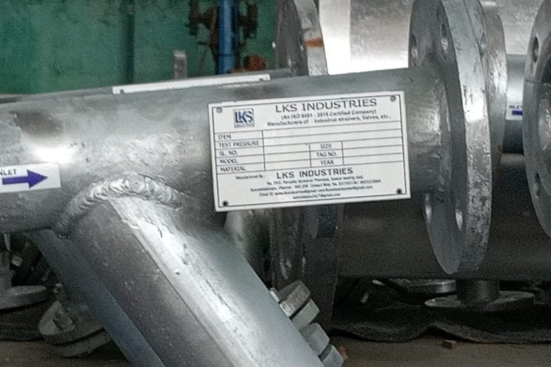 LKS Industries nameplate fitted to a completed strainer recording test pressure and job number