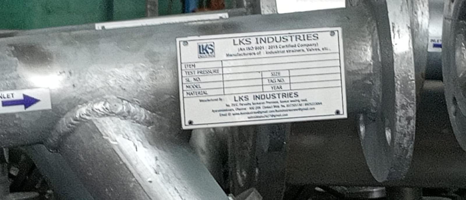 Nameplate fitted to a completed LKS Industries strainer recording test pressure and job details
