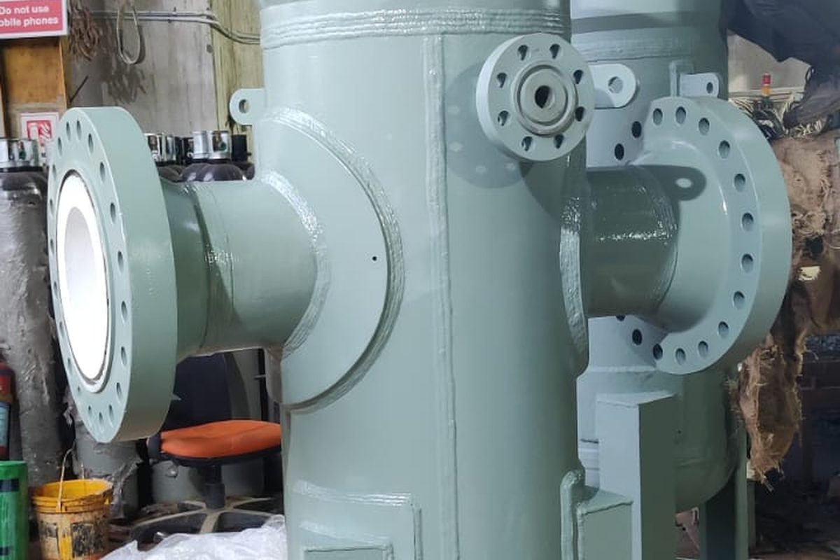 Lined basket strainer with protective bore coating for aggressive chemical service