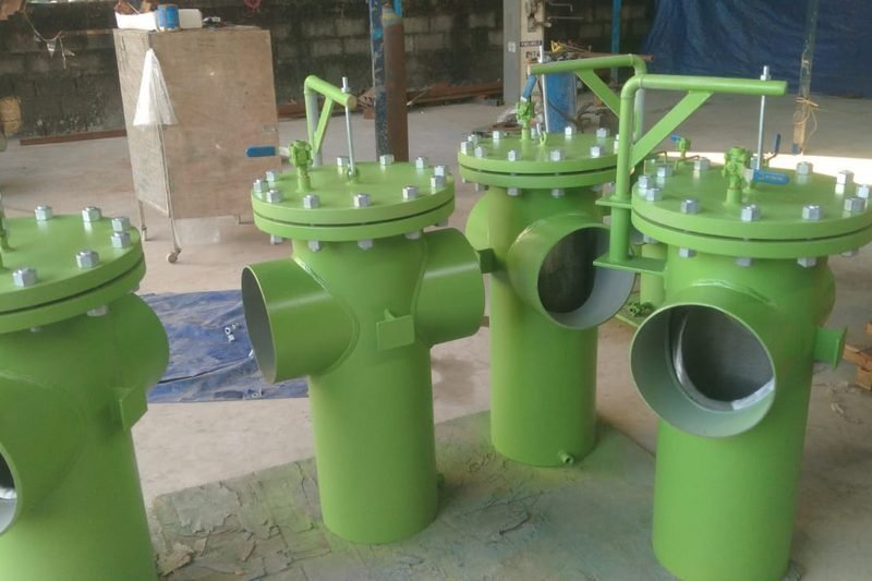 Four green coated basket strainers with buttweld branch connections