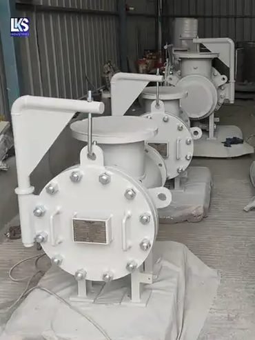 Several strainer housings with hinged covers lined up before despatch